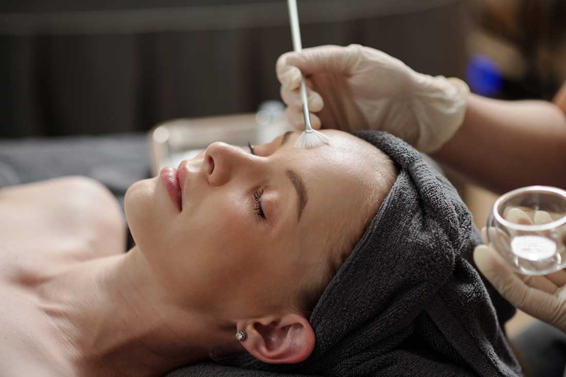 Client receiving a personalized chemical peel treatment