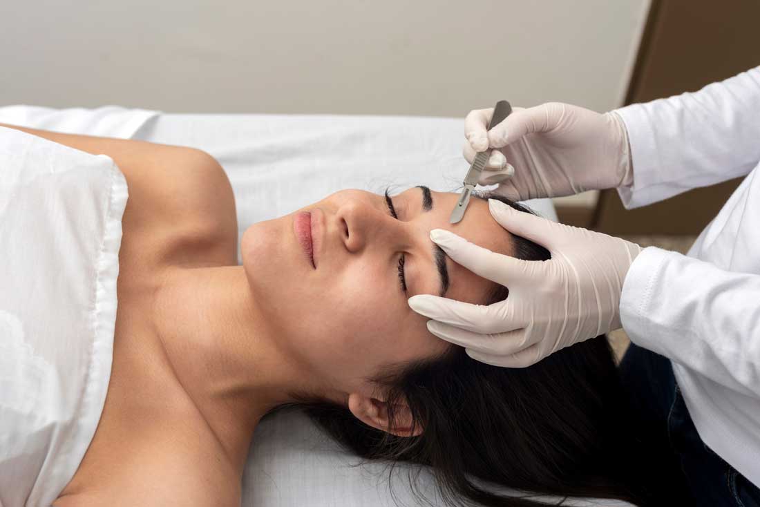 Client receiving dermaplaning facial treatment in Charleston, SC