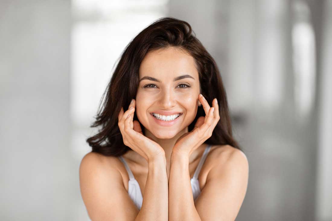 Woman revealing smoother skin after DiamondGlow® facial treatment
