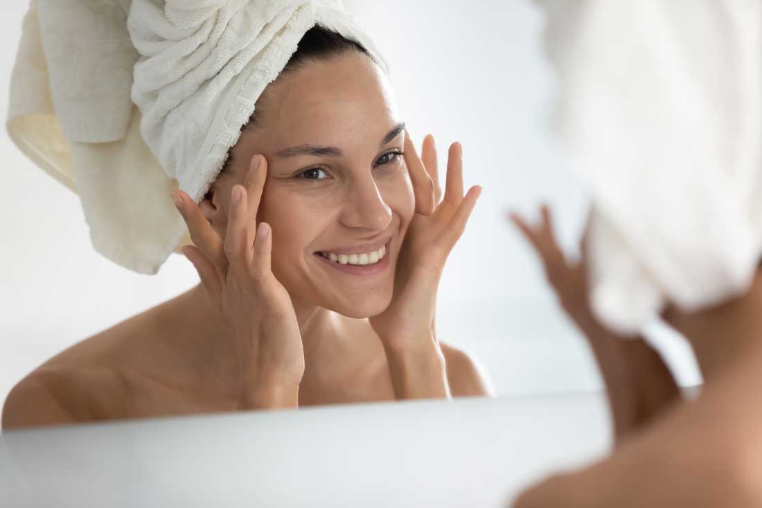 Woman showing smoother skin after a chemical peel treatment